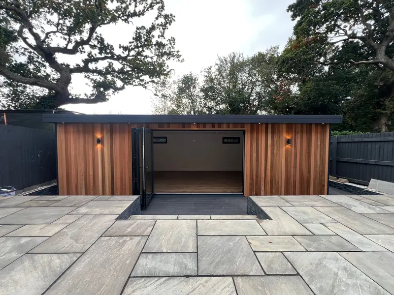 Everglow One garden room fitted out as a games room and bar, 8.0m by 4.0m, in western red cedar cladding with dark oak flooring